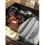 A box of cameras and accessories to include Olympus OM10, JVC camcorder, Finepix digital camera,