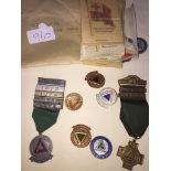 Bag of medallions and envelope of British Empire silk flags