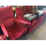 An early 20th century settee with red upholstery together with an armchair
