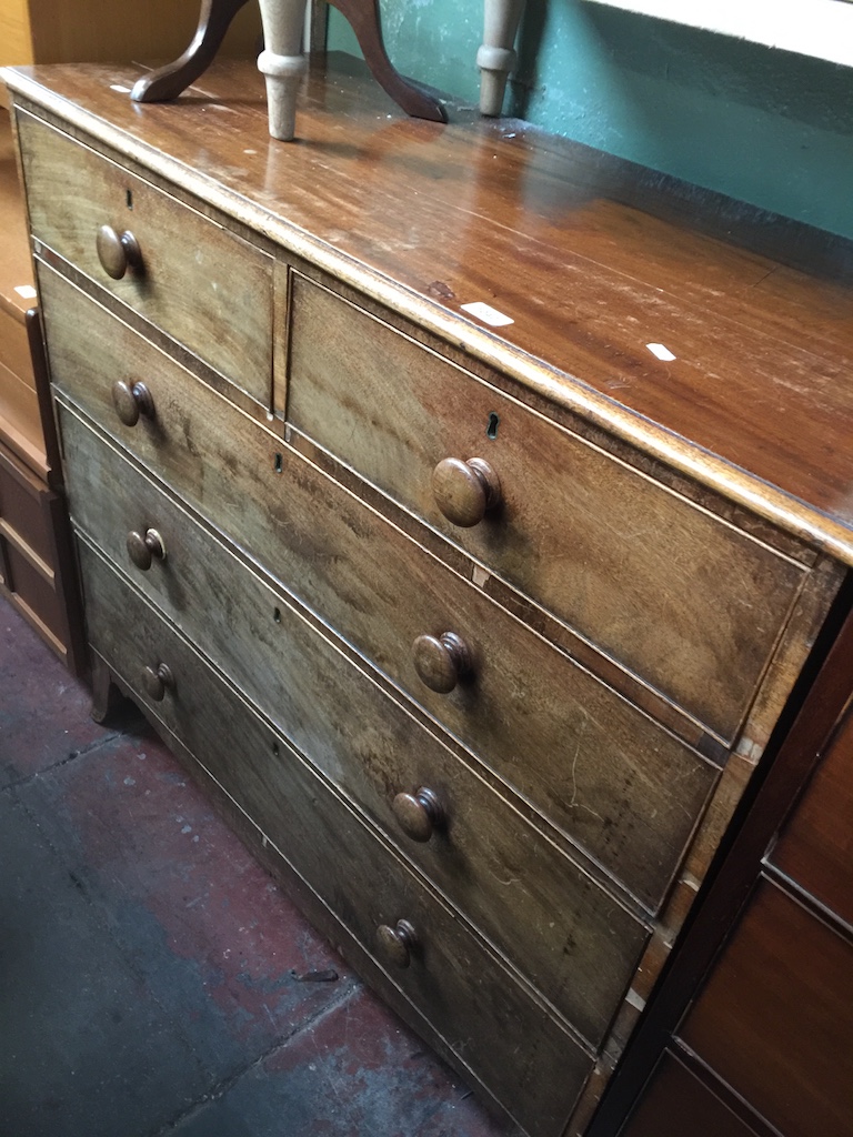 A 19th century mahogany chest of drawers with bun handles
