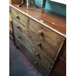 A 19th century mahogany chest of drawers with bun handles