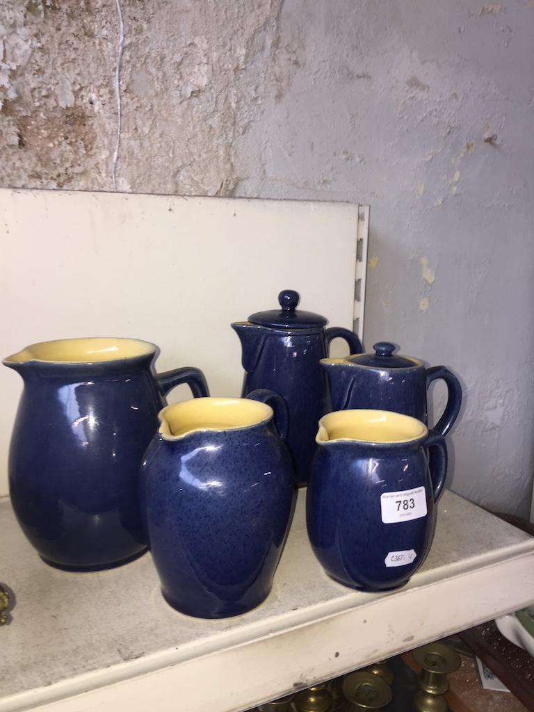 Five blue Denby jugs