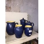 Five blue Denby jugs