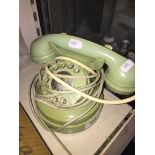 Vintage light green circular telephone