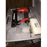 A pneumatic nailer and a soldering kit - both cased.