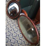 Two oval mirrors