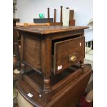 An oak stool/table with single drawer