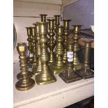Various brass candlesticks