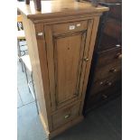 A stripped and waxed pine single cupboard