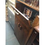 A retro walnut drinks cabinet with cased cocktail items