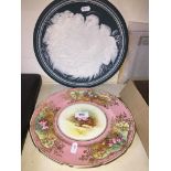 Royal Doulton rose painted plate and a Mettlach relief moulded plate 'Maria Mit Kind'