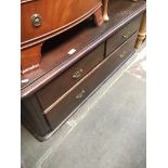 A mahogany low bed end chest