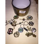 Tub of brooches