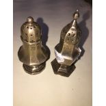 Pair of small silver condiments and a silver page marker with bear top