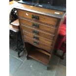 A mahogany record cabinet with art nouveau handles