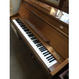 A Kimball U.S.A. upright piano, model no.X420, h106cm, w144cm d56cm.