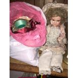 A 1920's Armand Marseille bisque doll and a bag with small dolls, accessories and few ladies