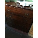 A 19th century mahogany chest of drawers with brass swan neck handles