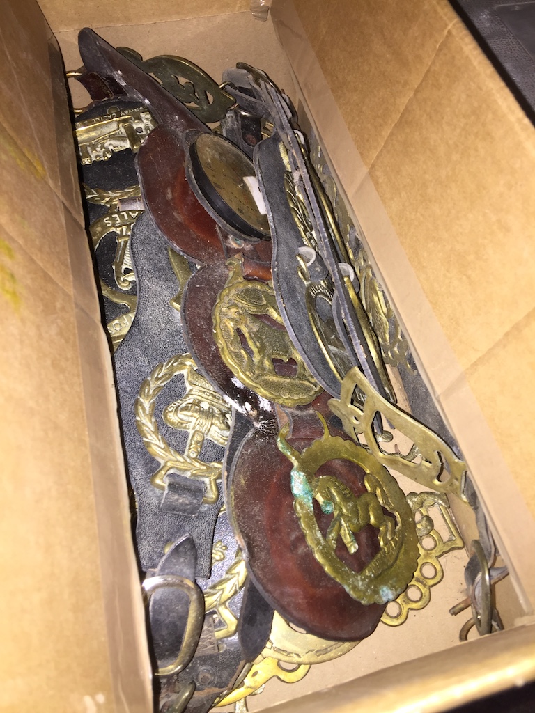 A box of horse brasses