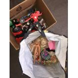 A box and a bag of toys, cars, trucks, dolls, etc.