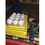 2 boxes of golf balls, a chipping net, etc
