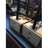 A pair of retro wall mounting teak bedside cabinets on single tapered leg