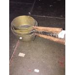 A set of 4 graduated brass pans