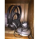 A set of Panasonic cordless headphones RP WF910H with docking station and charging cable
