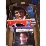 A box of Elvis Presley LPs and books