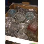 A box of small glass dishes.
