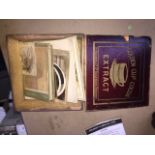 A wooden box containing old / antique pictures.