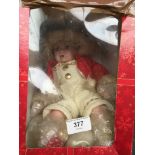 A boxed Leonardo Christmas porcelain doll