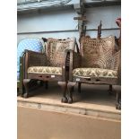 A pair of oak framed bergere armchairs