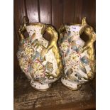 Pair of floral encrusted pottery vases