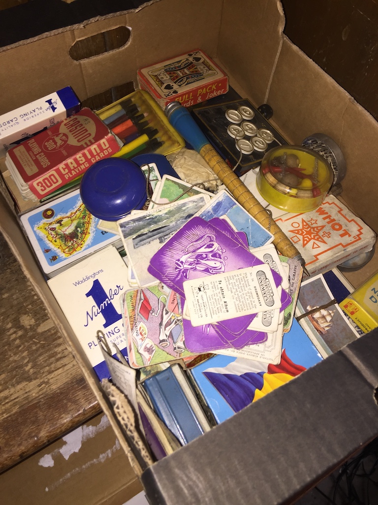 A box of mainly playing cards, etc.