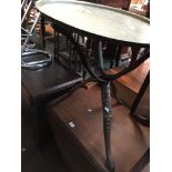An eastern brass top folding table with inlay to base