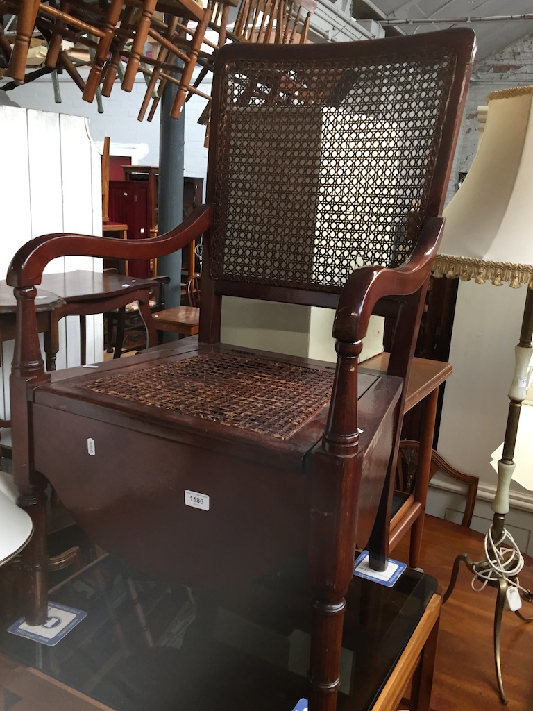 A bergere back commode chair