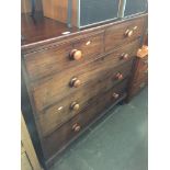 A 19th century mahogany chest of drawer with bun handles and bracket feet.