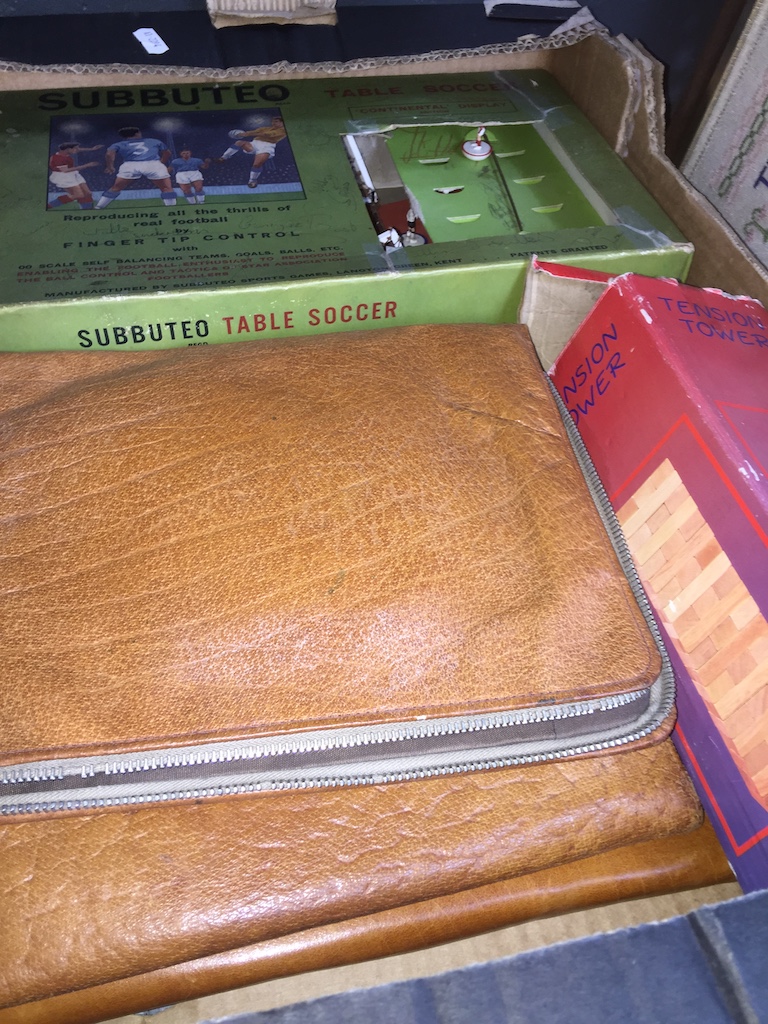 Box containing Subuteo game and leather wallets