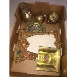 Box of various brass items including photo frame, bells and a gamebird ashtray.