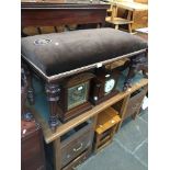 A late Victorian mahogany duet piano stool with upholstered top.