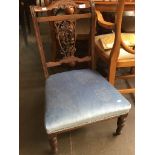 An Edwardian low nursing chair