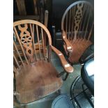 A pair of wheel back carver chairs