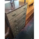 A retro tall chest of drawers, on tapered legs, H113cm.