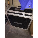 A music equipment box on wheels and with handle containing various cables and a Chauvet DJ