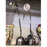 Two steel adjustable lamps