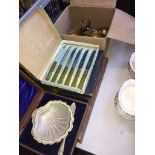Boxed cutlery and a small box of brassware
