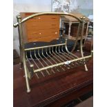 A brass magazine/paper rack