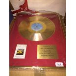 A Spinners gold disc 'presented to Mrs J M Hewitson for choosing Spun Gold....'