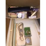 A box of costume jewellery including horn and white metal, beads etc.